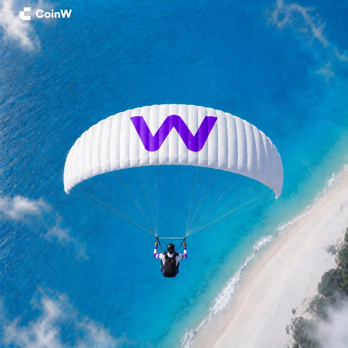 A promotional image for CoinW showing a person paragliding over a turquoise ocean with the CoinW 'W' logo on the parachute.
