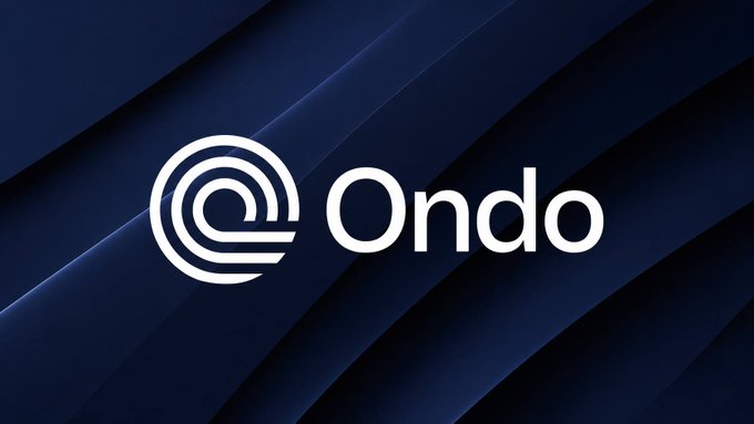 The image displays the Ondo logo—a stylized "@" symbol alongside the "Ondo" wordmark—set against a sleek dark navy blue background with diagonal lines, visually reinforcing the brand's identity as it highlights the rapid adoption timeline of tokenized assets compared to traditional financial products.