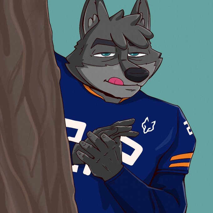An anthropomorphic wolf character with grey fur and blue eyes wearing a blue jersey stands partially behind a tree, appearing dazed with his tongue slightly out.