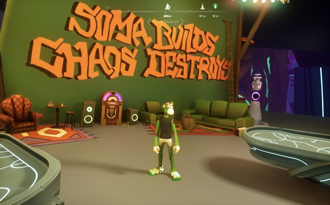 A screenshot from a virtual reality environment showing a green cartoon character standing in a lounge area with furniture, where large graffiti-style orange text on the wall reads 'SOMA BUILDS CHAOS DESTROYS'.