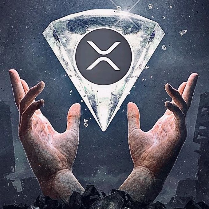 Two weathered hands reach upward holding a crystal diamond shape containing a dark circle with an 'XRP' cryptocurrency logo.