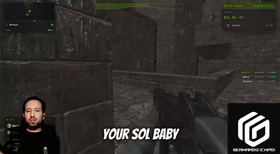 The image features a man sitting at a computer with a gaming mousepad in front of him. The background shows a brick wall and a stone wall, creating an immersive gaming environment. A caption below the image reads "Your Solana was earned. Life is good." This message seems to be related to the game they are playing, possibly a shooting or strategy game like Minecraft.