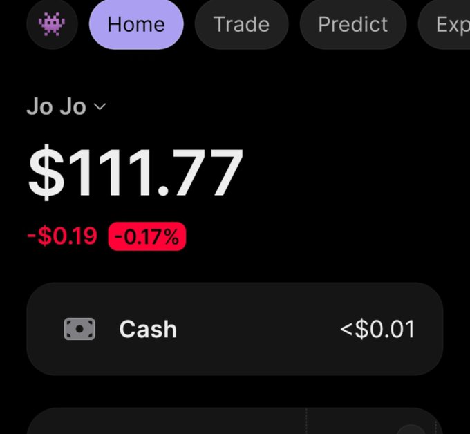 A cryptocurrency trading app screenshot showing a portfolio labeled 'Jo Jo' with a total value of $111.77, showing a decrease of $0.19 or -0.17%, and a cash holding of less than $0.01.