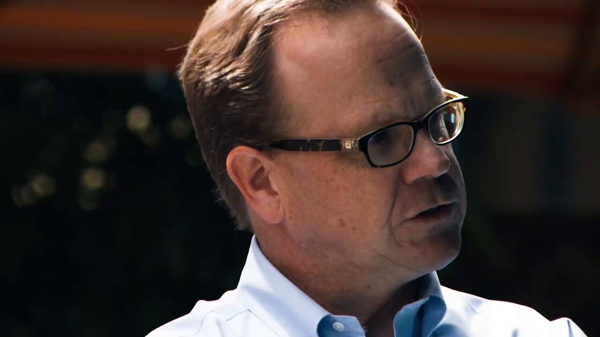 The image features a man wearing glasses with brown frames who appears to be looking off into the distance or deep thought. The photo has been edited to include a caption that reads "You should’ve seen it, it was awesome Neet coin". This suggests that the man in the picture might have captured an interesting or noteworthy moment related to the post about the Neet coin featured on the image.