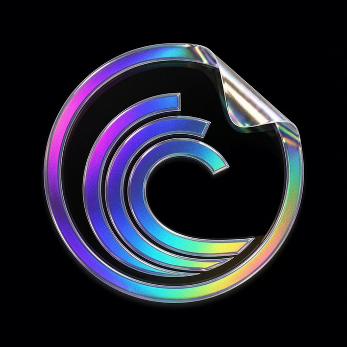 A holographic, iridescent logo featuring a stylized letter 'C' inside a circular border with a peeled corner, set against a black background.