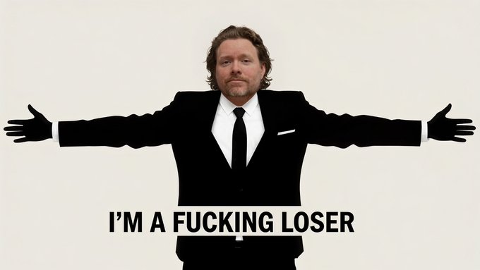 A man in a black suit stands against a white background with his arms outstretched horizontally, accompanied by the caption 'I'M A FUCKING LOSER' — a still from the film 'The Lookout.'