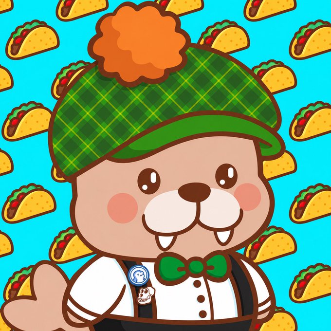 A cute cartoon beaver mascot with a fluffy orange pompom, green plaid hat, bowtie, and suspenders stands against a teal background patterned with repeating tacos, matching the cheerful "Happy Taco Tuesday" spirit of the GM post.
