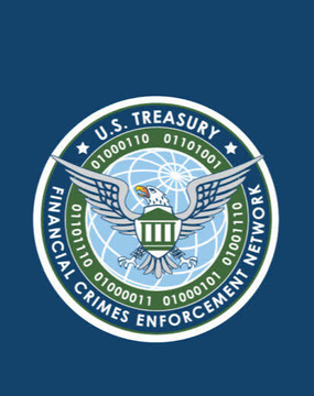 The image displays the official seal of the U.S. Treasury's Financial Crimes Enforcement Network (FinCEN), featuring an eagle emblem with binary code and the text "U.S. TREASURY" and "FINANCIAL CRIMES ENFORCEMENT NETWORK." The seal relates to the post by representing FinCEN, the agency whose two proposed crypto regulations—the 2020 self-custody wallet reporting rule and the 2023 mixer designation rule—have been cancelled without ever being finalized.