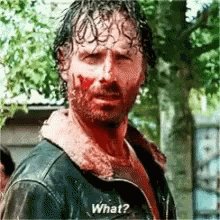 The image shows a man with a red face who appears to be angry or upset. The text "What?" is written above his head, which could be part of a caption for the image. The caption also includes an instruction to look up the answer in Bitcoin.