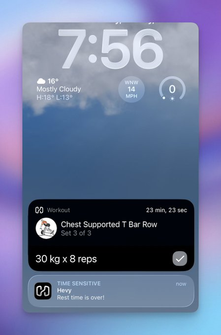 An iPhone lock screen displays the time 7:56, weather showing 16° Mostly Cloudy, and a workout notification for 'Chest Supported T Bar Row' completing '30 kg x 8 reps' in 23 minutes, 23 seconds, with a 'Heavy Rest time is over!' alert.