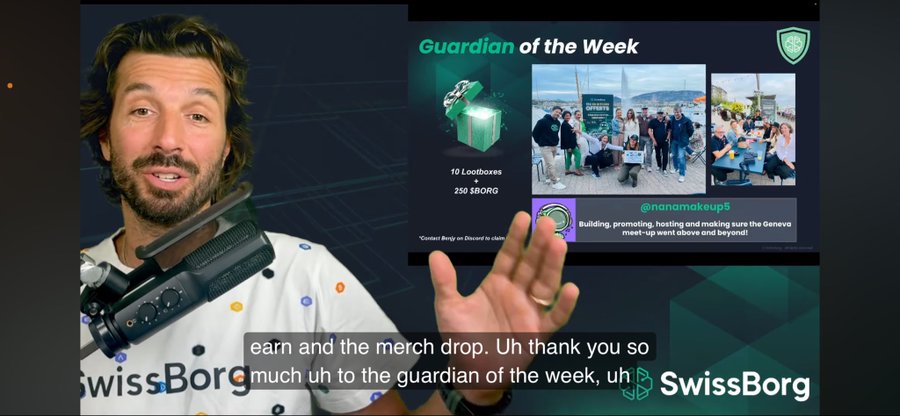 A video screenshot of a man speaking into a microphone while presenting a 'Guardian of the Week' segment for SwissBorg, highlighting @nanomakeup5 with rewards of 10 Lootboxes and 250 $BORG.