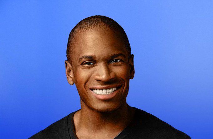 A close-up portrait of a smiling young man with short hair, wearing a dark shirt, against a solid blue background. The image serves as a profile photo for Arthur Hayes (@CryptoHayes), who is highlighted in the post as having recently purchased 10.9 million $ENA tokens worth $985K.