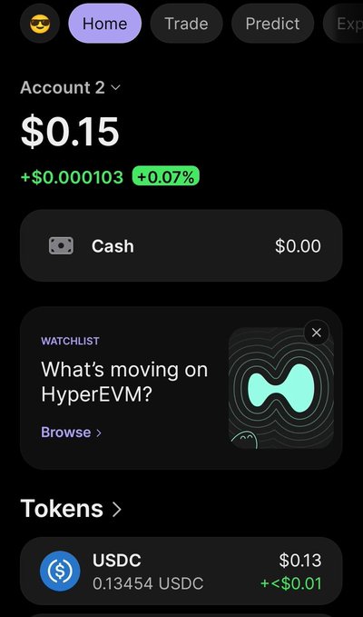 A mobile app interface displays an account balance of $0.15 with a +0.07% gain, showing tabs for Home, Trade, and Predict, along with a watchlist prompt for HyperEVM.