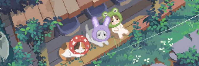 Pixel art illustration showing two small characters wearing frog and bunny hoodies sitting on a wooden bench surrounded by greenery.