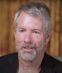 A middle-aged man with gray hair and a beard, likely MicroStrategy's Michael Saylor, wearing a dark shirt. The image accompanies a post drawing parallels between Do Kwon's 2022 UST collapse and Saylor's current use of STRC to acquire Bitcoin, questioning whether Bitcoin might eventually need to be sold to support STRC.