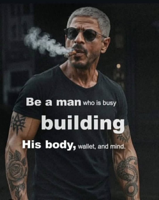 A motivational poster featuring a muscular tattooed man wearing sunglasses and smoking a cigar, with text reading 'Be a man who is busy building His body, wallet, and mind.'