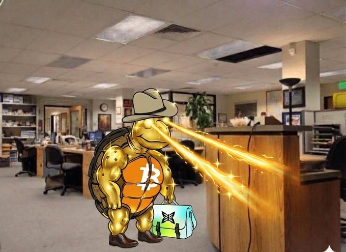 The image features an office scene where a cartoon turtle character, wearing a cowboy hat, is holding a suitcase with a blue bag inside of a cubicle. The turtle has two glowing eyes that appear to be emitting light from its head. In the background, there are several chairs and desks, suggesting it's a typical office setting.

The post includes text that reads "I'm locked in with @quipnetwork I have to qualify for this QUIP airdrop somehow Let’s ride it together bros!". This message is related to the image as it seems to be promoting an airdrop or giveaway, possibly involving the cartoon turtle character and his suitcase.