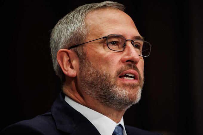 A close-up photo of Brad Garlinghouse, Ripple's CEO, who is shown wearing glasses and a dark suit while speaking, visually accompanying a post urging the U.S. Senate to pass the Clarity Act.