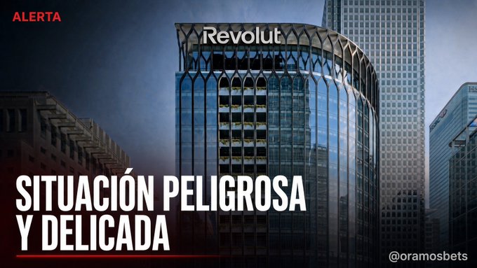 A news graphic showing the Revolut headquarters building with Spanish text overlays reading 'ALERTA', 'SITUACIÓN PELIGROSA Y DELICADA', and the handle '@oramosbets'.