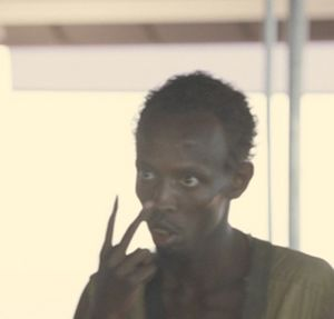 A man with a serious, intense expression points his index finger upward, appearing to emphasize an important point—mirroring the post's urgent message about $LPTH (LightPath Technologies) being a high-conviction trade due to its sub-$1B market cap, anticipated government funding, and upcoming 2027 DFARS restrictions on germanium mining that could drive demand for the company's alternatives.