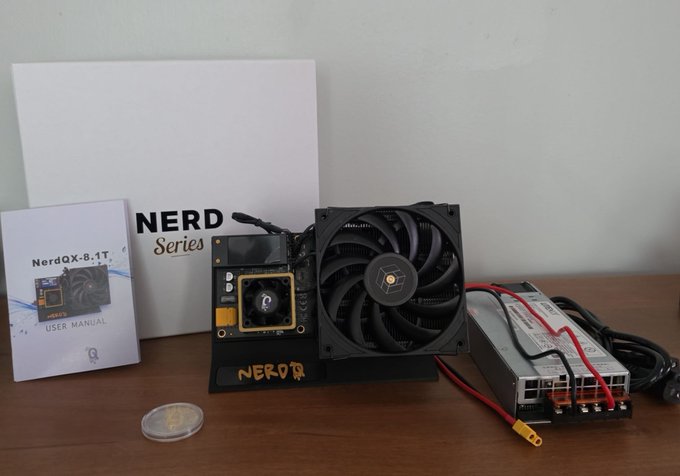Product display of a 'NerdOX-8.1T' crypto mining device with a fan, power supply, and user manual, with a coin shown for scale.