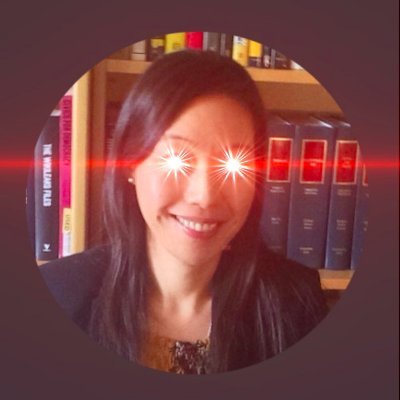 A circular profile photo of a smiling Asian woman with long dark hair standing in front of a bookshelf, with a red laser beam effect overlaid horizontally across her eyes.