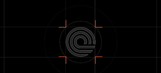 A wireframe "S" logo sits centered within orange alignment crosshairs and concentric dotted circles against a black background, suggesting Saturn's branding is being positioned or "targeted" — visually reinforcing the post's hint that something is being lined up with Saturn next.