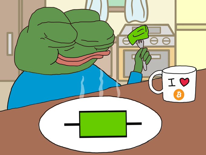 The Pepe the Frog meme depicted as a content frog sitting at a kitchen table with a Bitcoin-themed 'I ❤️ Bitcoin' mug and a green object on a plate.