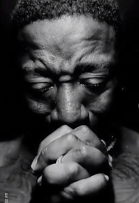 The image features a man wearing minimal clothing, who appears distressed or upset as if he has been experiencing financial difficulties like losing $100 within three days. The image is described as being in black and white, which adds an element of timelessness to the scene. There are no other people or objects visible in the photo.