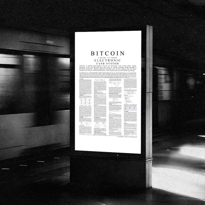A digital billboard in a dark setting displays the original Bitcoin whitepaper, titled 'BITCOIN: A PEER-TO-PEER ELECTRONIC CASH SYSTEM'.