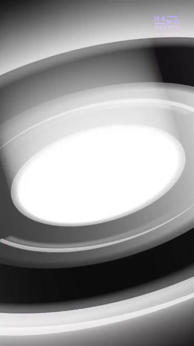 The image features a close-up of an illuminated white circle set against a black background with slight shading. The light source radiates outwards from the center, creating a glowing effect around the circle. There are two different shades of gray present within the scene, adding depth and contrast to the overall composition. In addition, there is text in the image that reads "$XRP IS QUIETLY BECOMING THE BRIDGE CURRENCY OF THE entire world: over $150 TRILLION moves across borders every single year if even a fraction of that starts flowing through XRP". The purpose and message behind this artwork appear to be centered around the rise and potential of cryptocurrency.
