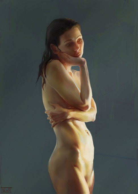 The image features a woman with her arms crossed, standing against a blue background. She appears to be posing for a portrait or art piece, as she has her hands resting on her hips. The photo seems to have been taken at night, which is indicated by the dark and dim lighting in the scene.