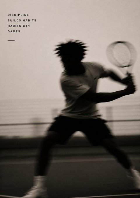 A black and white photograph of a tennis player mid-swing, appearing as a silhouette, with the inspirational text 'DISCIPLINE BUILDS HABITS. HABITS WIN GAMES.' in the upper left corner.