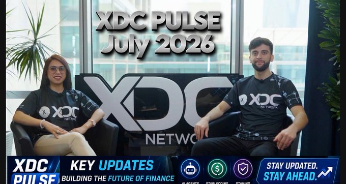 A thumbnail for 'XDC PULSE July 2026' featuring two people in XDC Network branded shirts sitting in chairs, with text 'KEY UPDATES - BUILDING THE FUTURE OF FINANCE' and 'STAY UPDATED. STAY AHEAD.' along with icons for AI Agents, Staking, and other features.