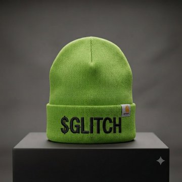 A green Carhartt beanie hat displayed on a black pedestal, embroidered with black text reading '$GLITCH' on the cuff.