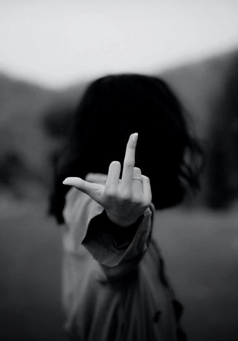 "Ghvd Mhvrning Lovelies" is a phrase used as an acronym for "Global Financial Volatility Index", which is a measure of market volatility. The image features a woman with long hair, dressed in a white jacket, making a peace sign gesture by placing her middle finger in the air. This action can be interpreted as a symbol of defiance or protest against the Global Financial Volatility Index (Ghvd Mhvrning Lovelies).