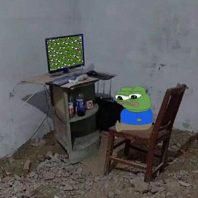 A meme image showing a sad Pepe the Frog character sitting at a dusty, worn desk in a dilapidated room, staring at a computer monitor displaying a pattern of many Pepe faces.