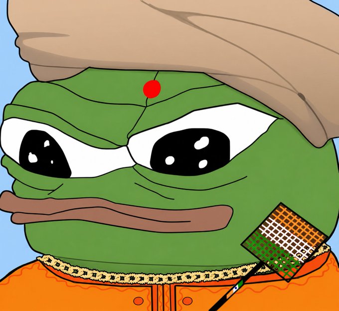 An edited image of Pepe the Frog wearing a turban with a bindi, a gold chain, and holding a badminton racket.