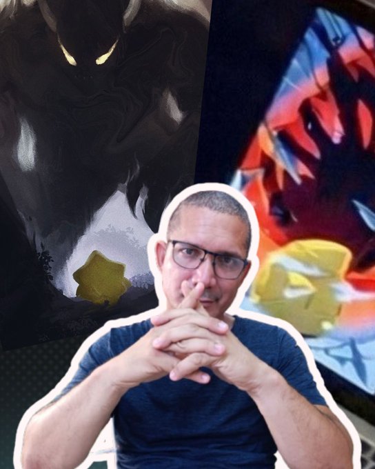 The image features a man with glasses posing for a picture, wearing a blue shirt. The background of the photo includes a poster or painting that depicts a monster, possibly a werewolf or a dragon, surrounded by a bunch of stars. The man is positioned in front of this artwork and appears to be making a funny face as if he's scared off by the monster.