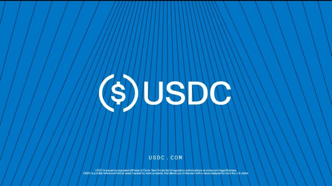 **($)USDC — USDC.COM** — A blue promotional banner for the USDC stablecoin with regulatory disclosure text at the bottom.