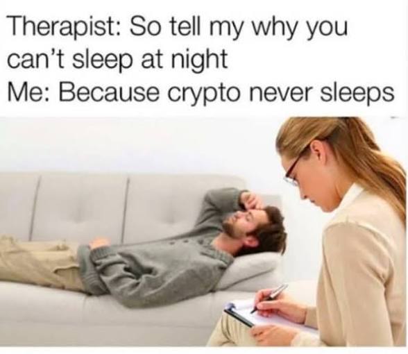 The image features a woman sitting next to a man who appears to be sleeping on a couch, with a notebook nearby. The caption of the image reads "Therapist. So tell my why you can't sleep at night Me: Because crypto never sleeps." This statement is likely meant as a humorous response to the fact that the man is sleeping while the woman is awake and writing in her notebook.