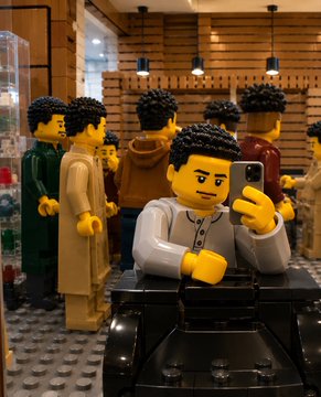 A Lego figure smiles while taking a selfie with his phone, surrounded by other Lego characters in what appears to be a retail or office setting.

The image ties into the post's upbeat "Good morning frens" greeting by using the cheerful, friendly Lego character as a mascot for the crypto community's optimistic "WAGMI" (We're All Gonna Make It) sentiment and shared mission to win together.