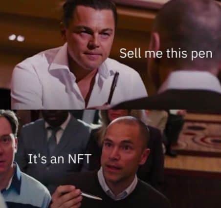 A two-panel meme referencing the famous "Sell me this pen" scene from *The Wolf of Wall Street*, with text reading "Sell me this pen" and "It's an NFT," jokingly suggesting NFTs are as difficult to sell as the pen in the film—a lighthearted "Gm" (good morning) greeting for crypto/NFT traders.