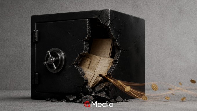 A black safe is shown cracked open on its side, with documents spilling out and gold coins flying through the air, bearing a "Media" watermark.