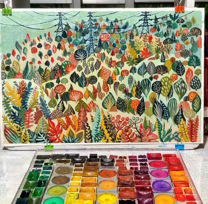 A watercolor painting of a vibrant landscape with colorful foliage and power lines is displayed above a pan of watercolor paints, representing the artwork "Galvanized Whispers, Verdant Silence" that was recently sold to @memonic_johnny.