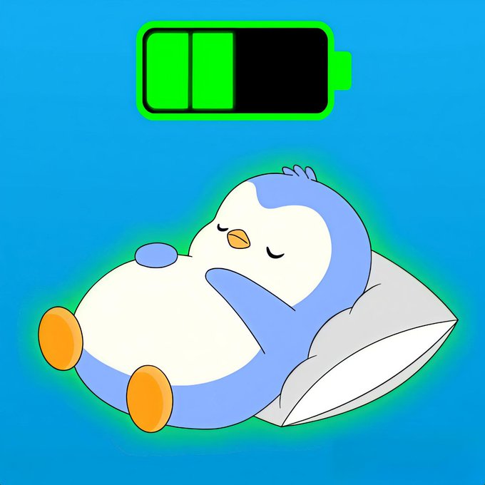 A cartoon illustration of a blue and white penguin sleeping on a gray pillow with a glowing green outline, beneath a battery icon showing about two-thirds charge on a blue background.