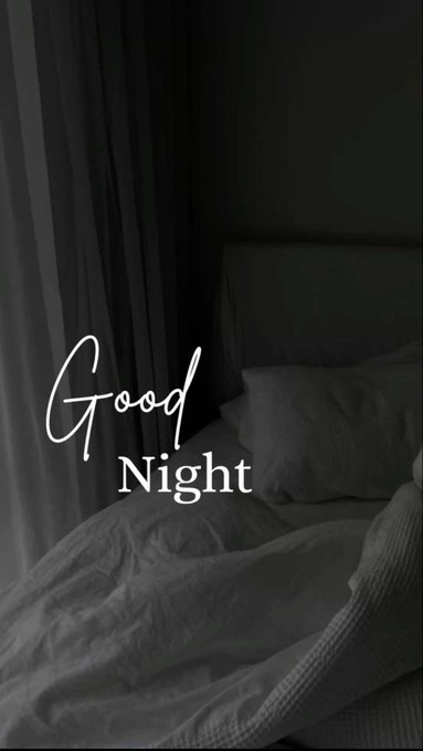 A dimly lit bedroom scene with gray bedding and curtains, overlaid with the text 'Good Night' in a white script and serif font.