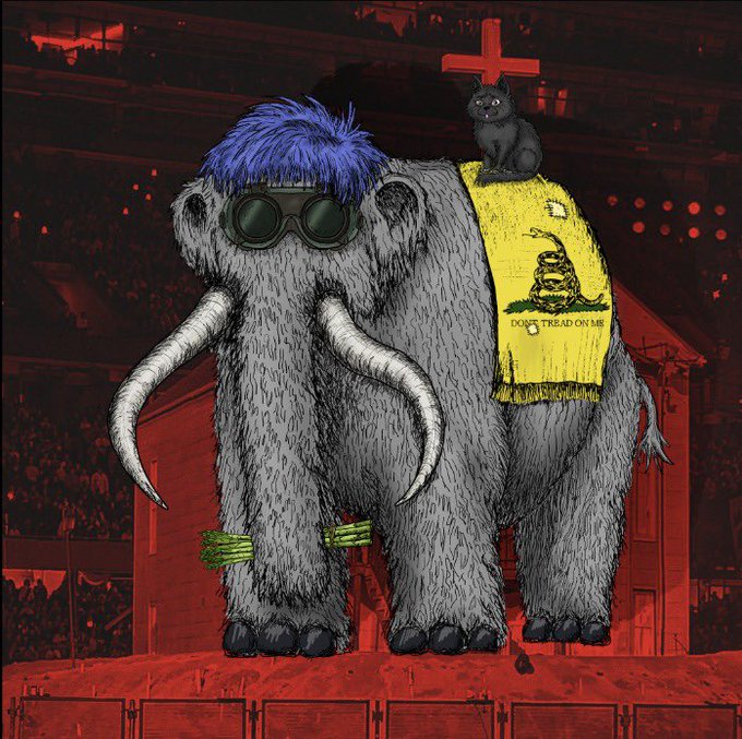 A woolly mammoth sporting purple hair and sunglasses stands on a red stage, draped in a yellow "DON'T TREAD ON ME" Gadsden flag with a black cat perched on top, symbolizing resilience and stubbornness despite market collapse—mirroring the poster's reflection on holding through a brutal downturn from $2k to zero while still remaining grateful for the journey.