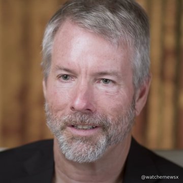 A headshot of a smiling man with grey hair and a beard, with a watermark reading '@watchemewsx' in the bottom right corner.