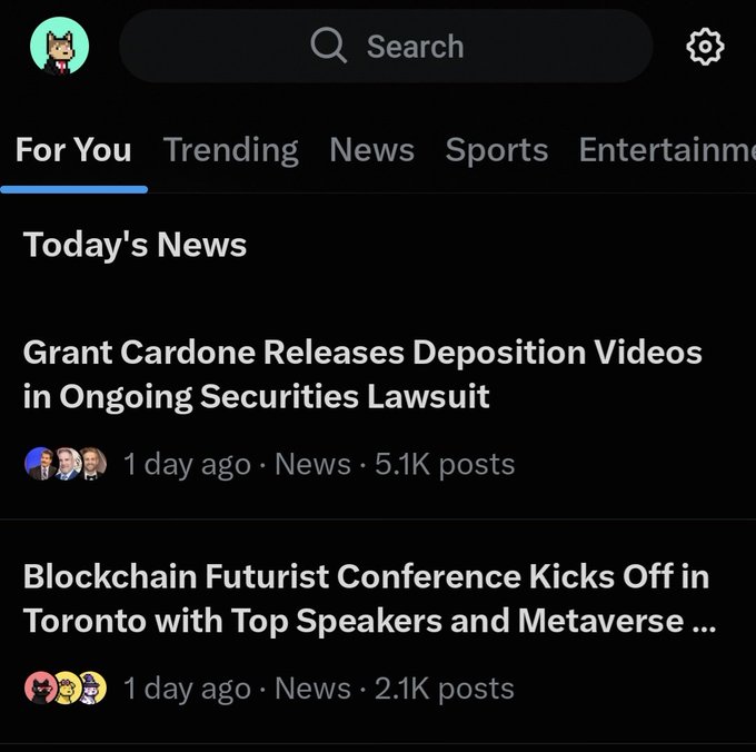 Mobile app screenshot of a 'For You' news feed showing headlines: 'Grant Cardone Releases Deposition Videos in Ongoing Securities Lawsuit' (5.1K posts) and 'Blockchain Futurist Conference Kicks Off in Toronto with Top Speakers and Metaverse' (2.1K posts).